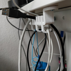 Držák kabelů a závěs pod psací stůl