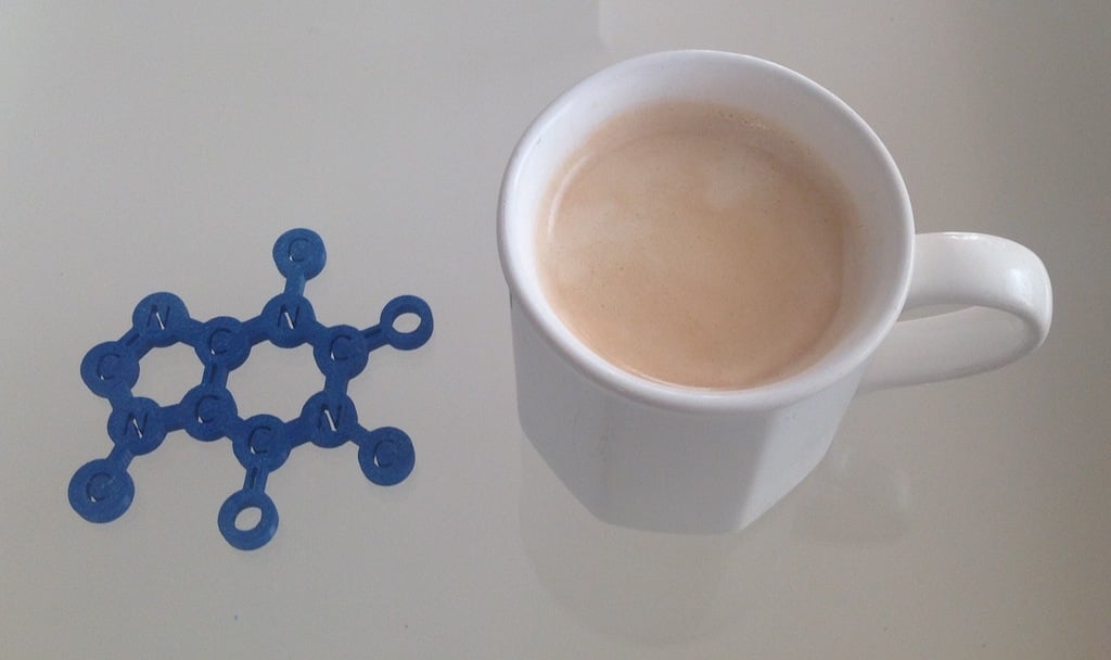 Prostírání s molekulou kofeinu pro šálky kávy