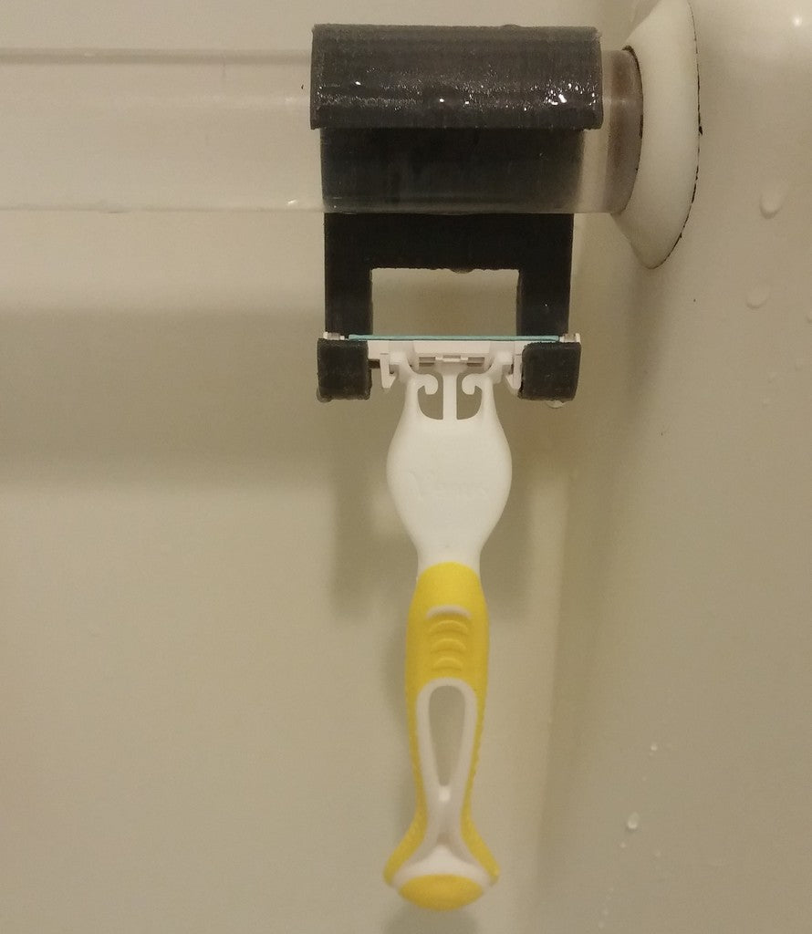 Koupelnový držák holicího strojku na sprchovou tyč
