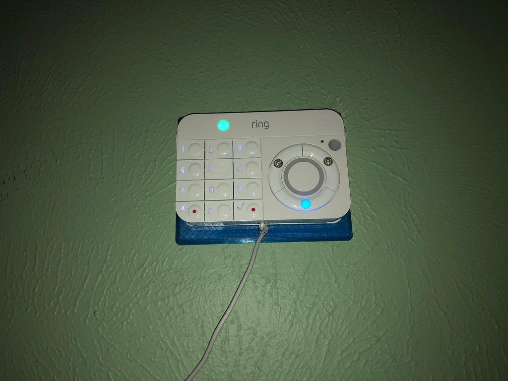 Držák na klávesnici vyzváněcího alarmu s vestavěným průchodem USB kabelu
