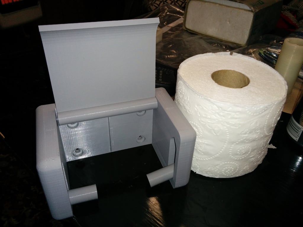 Přepracovaný držák toaletního papíru pro rychlou výměnu