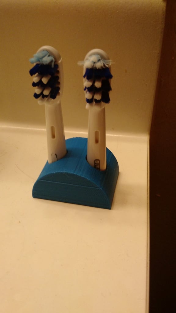 Držák na zubní kartáček Oral B do koupelny