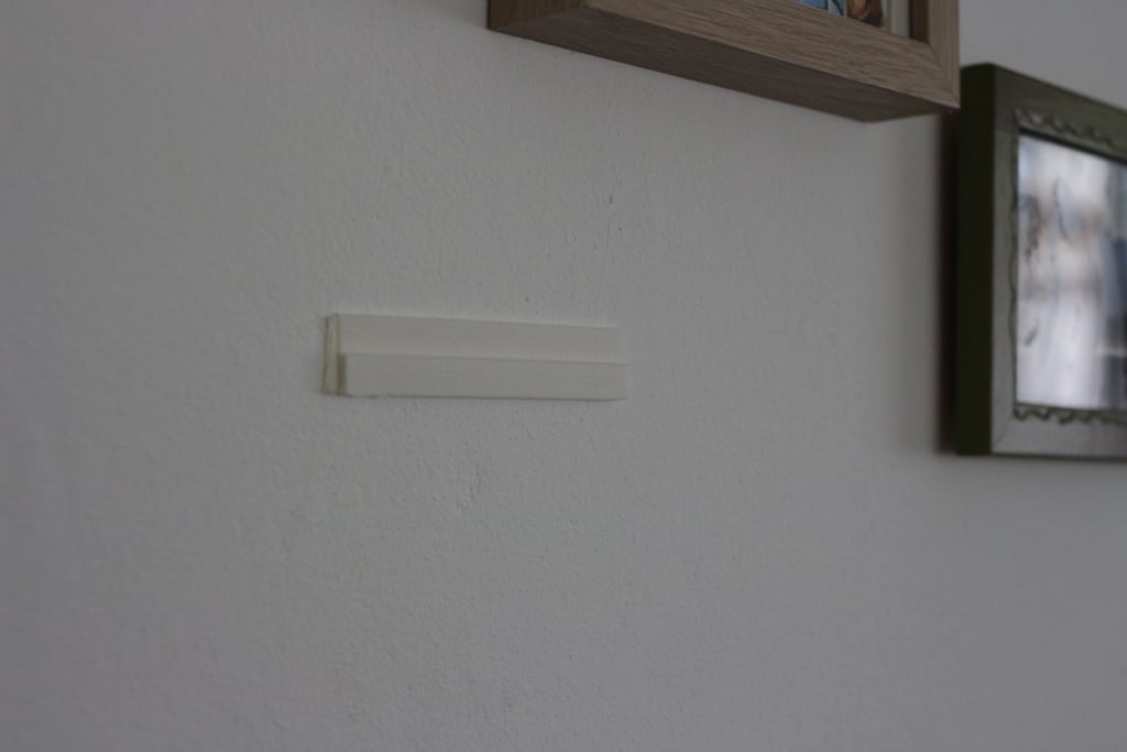 Univerzální a neviditelný držák na stěnu pro tablet / telefon