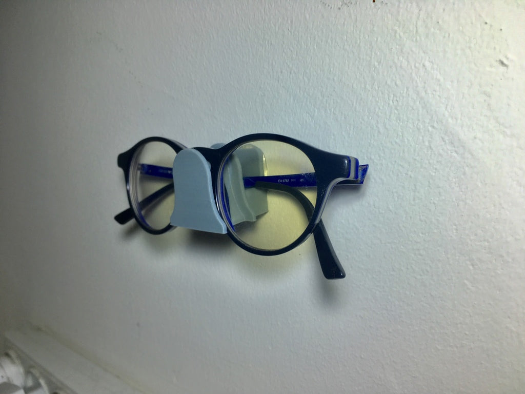 Nástěnný držák na brýle