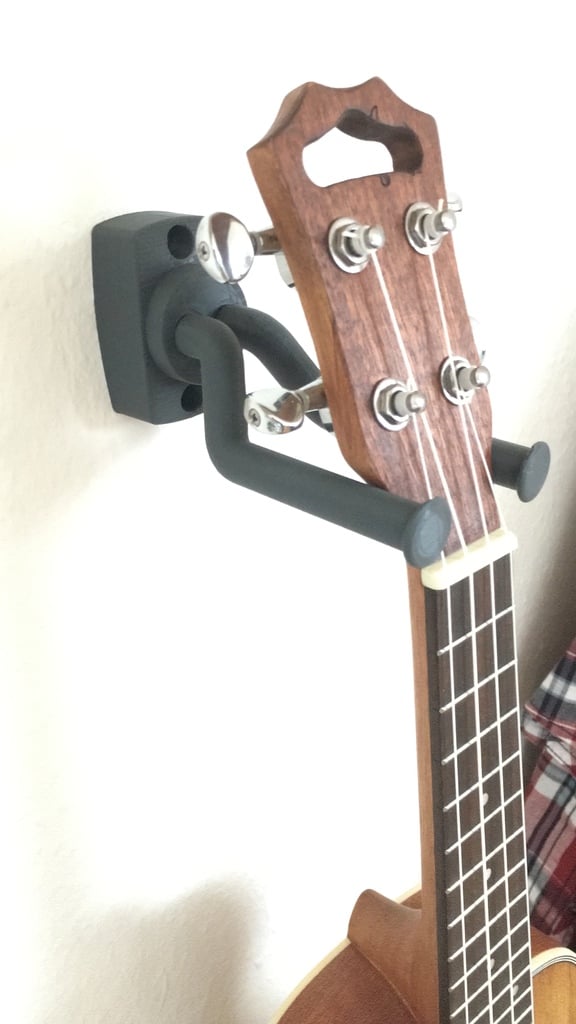Univerzální nástěnný držák pro kytaru s gravitačním držením a pohyblivými částmi